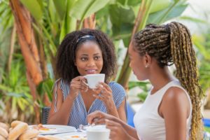 Two women enjoying Grand Cayman Restaurants.